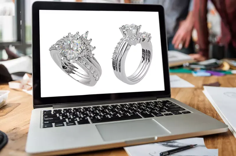 A custom engagement ring rendered in CAD at Wright Jewelers' workbench